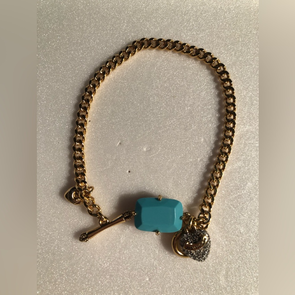 NWOT Vintage Juicy Couture Gold Chain Bracelet with three charms.